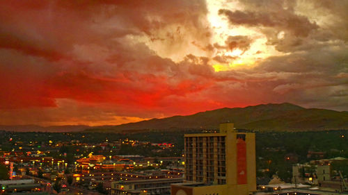 Dramatic sky over city at sunset