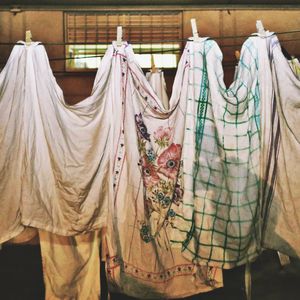 Close-up of clothes drying on string