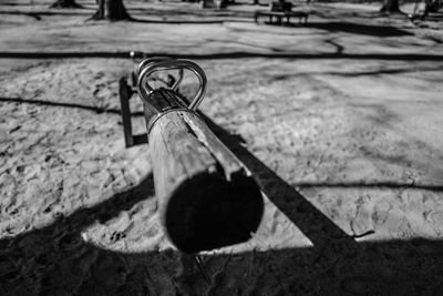 High angle view of shadow on bench in field