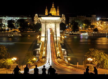 People enjoying view of budapest at night