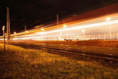 Light trails on railroad track at night