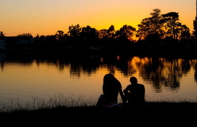 Scenic view of lake against sky during sunset