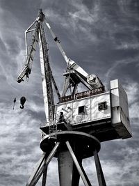 Low angle view of ferris wheel against sky