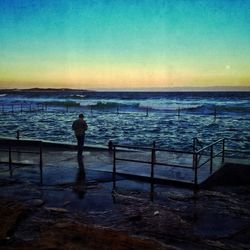 Scenic view of sea at sunset