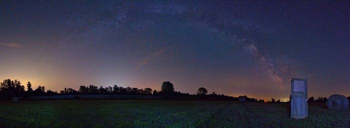 Scenic view of field against sky at night