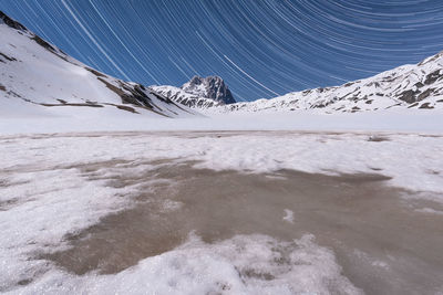 Frozen lake against sky