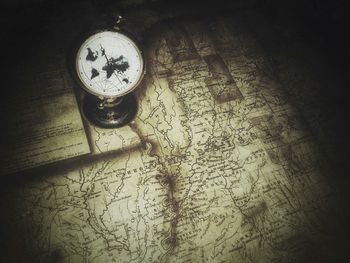 High angle view of clock on table