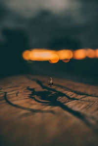 Close-up of table against sky during sunset