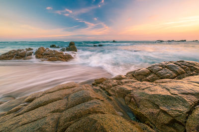 Scenic view of sea against sky during sunset
