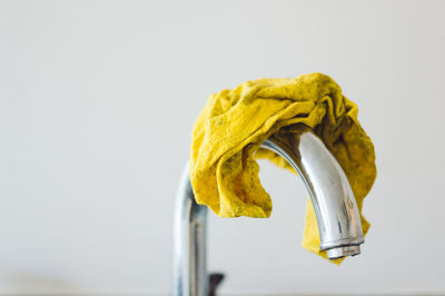 Close up of cleaning cloth on tap