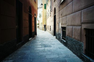 Narrow alley along buildings