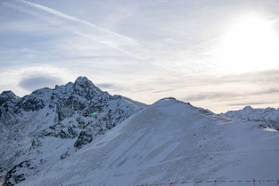 Scenic view of snowcapped mountains against sky