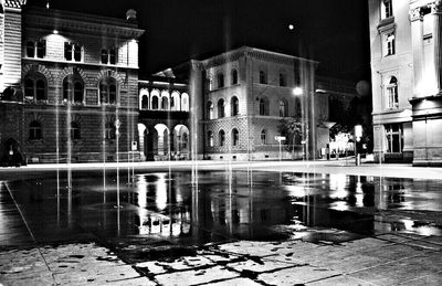 Illuminated buildings in city at night
