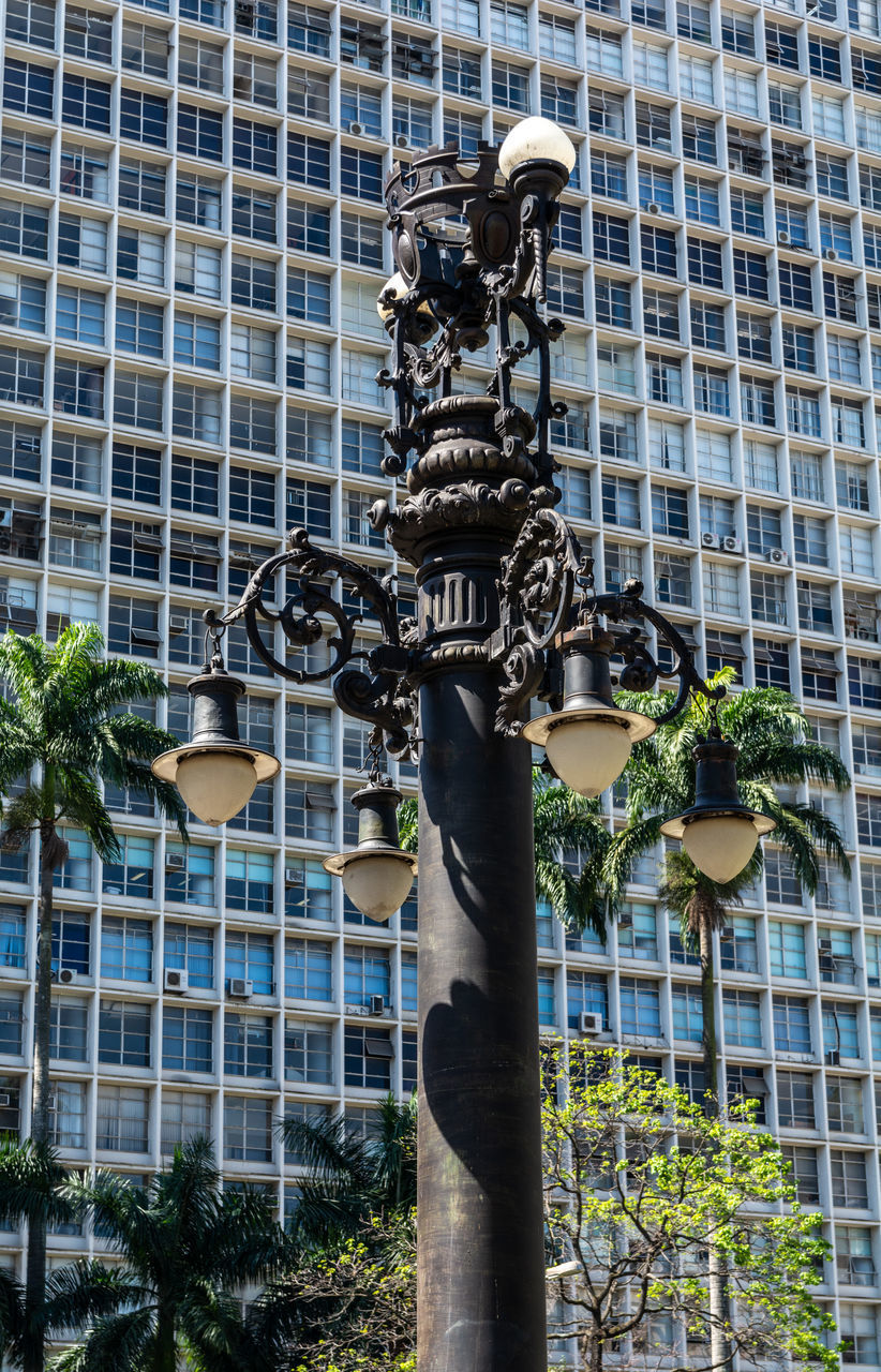 LOW ANGLE VIEW OF STREET LIGHT ON BUILDING