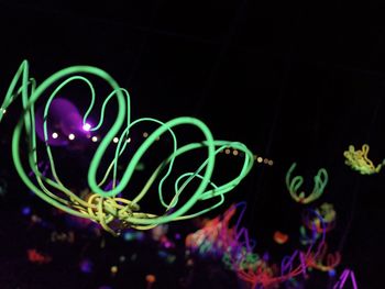 Close-up of light painting against black background