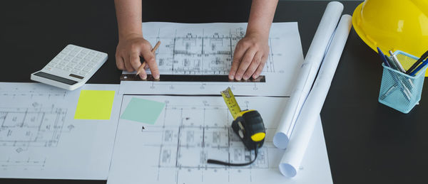 High angle view of man working on table