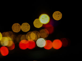 Close-up of lights over black background
