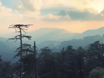 Scenic view of mountains against sky during sunset