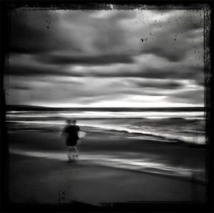 Scenic view of sea against cloudy sky