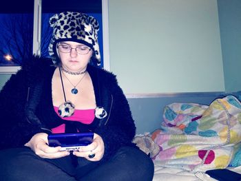 Portrait of smiling girl holding smart phone