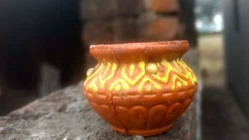 Close-up of pumpkin against wall