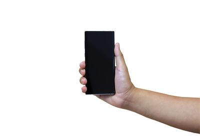 Midsection of person holding smart phone against white background
