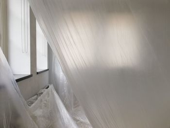 Close-up of white curtain at home