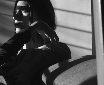 Young woman sitting outdoors