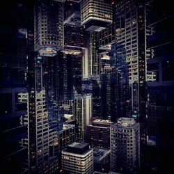 Aerial view of city lit up at night