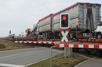 Train on railroad track against sky