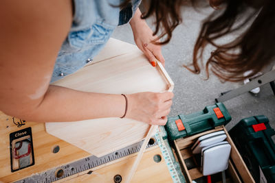 High angle view of woman working on table