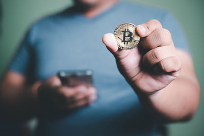 Close-up of man holding camera