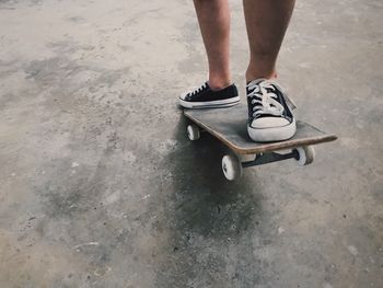 Low section of person skateboarding