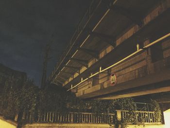 Low angle view of tree against building