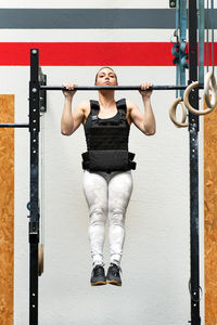 Young woman exercising at gym