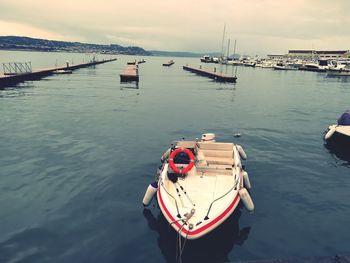 High angle view of sailboats moored on sea against sky