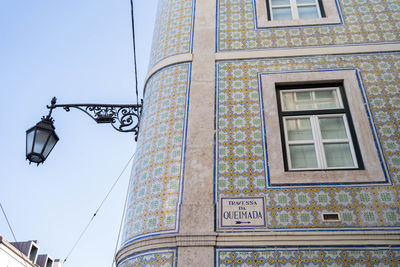 Low angle view of building against clear blue sky