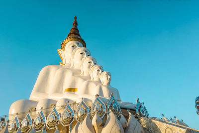 Low angle view of statue against clear blue sky