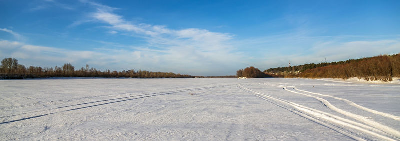 Scenic view of snowcapped landscape against sky