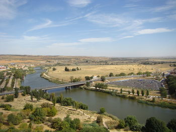 High angle view of river amidst landscape against sky