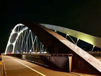 View of bridge in city at night