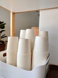 Close-up of white stack on table