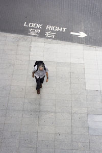 High angle view of man with text on road