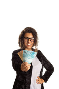 Portrait of a smiling young woman over white background