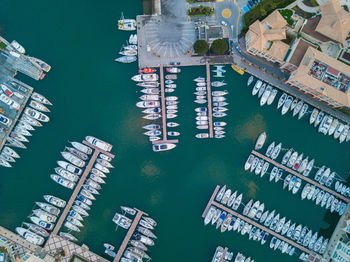 High angle view of information sign by sea against buildings