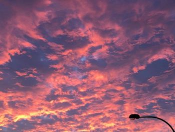 Low angle view of cloudy sky at sunset