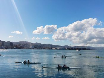 Panoramic view of people on nautical vessel against sky