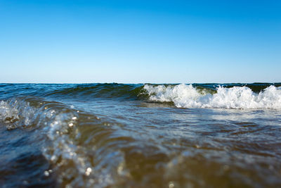 Scenic view of sea against clear blue sky