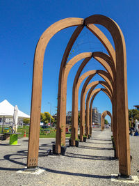 View of colonnade against clear blue sky