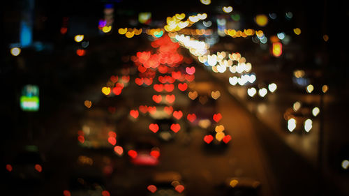 Defocused image of illuminated christmas tree at night